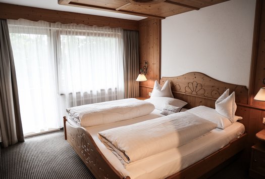 Appartement Bergzeit Gemütliches Doppelbett im Appartement Bergzeit